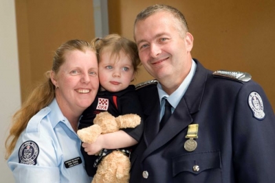 Firefighter Rob Gibbs with his wife Ann and daughter Mackenzie